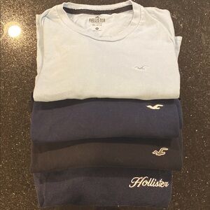 Hollister Set of 4 Long Sleeve Tees. Light Blue, navy blue and black